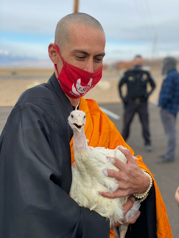 Robert Franklin holding a Turkey.
