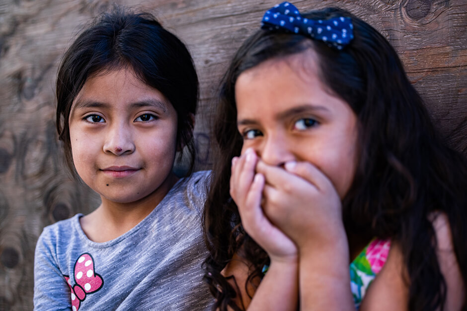 Girls near the walkway at the Agape migrant shelter in Tijuana